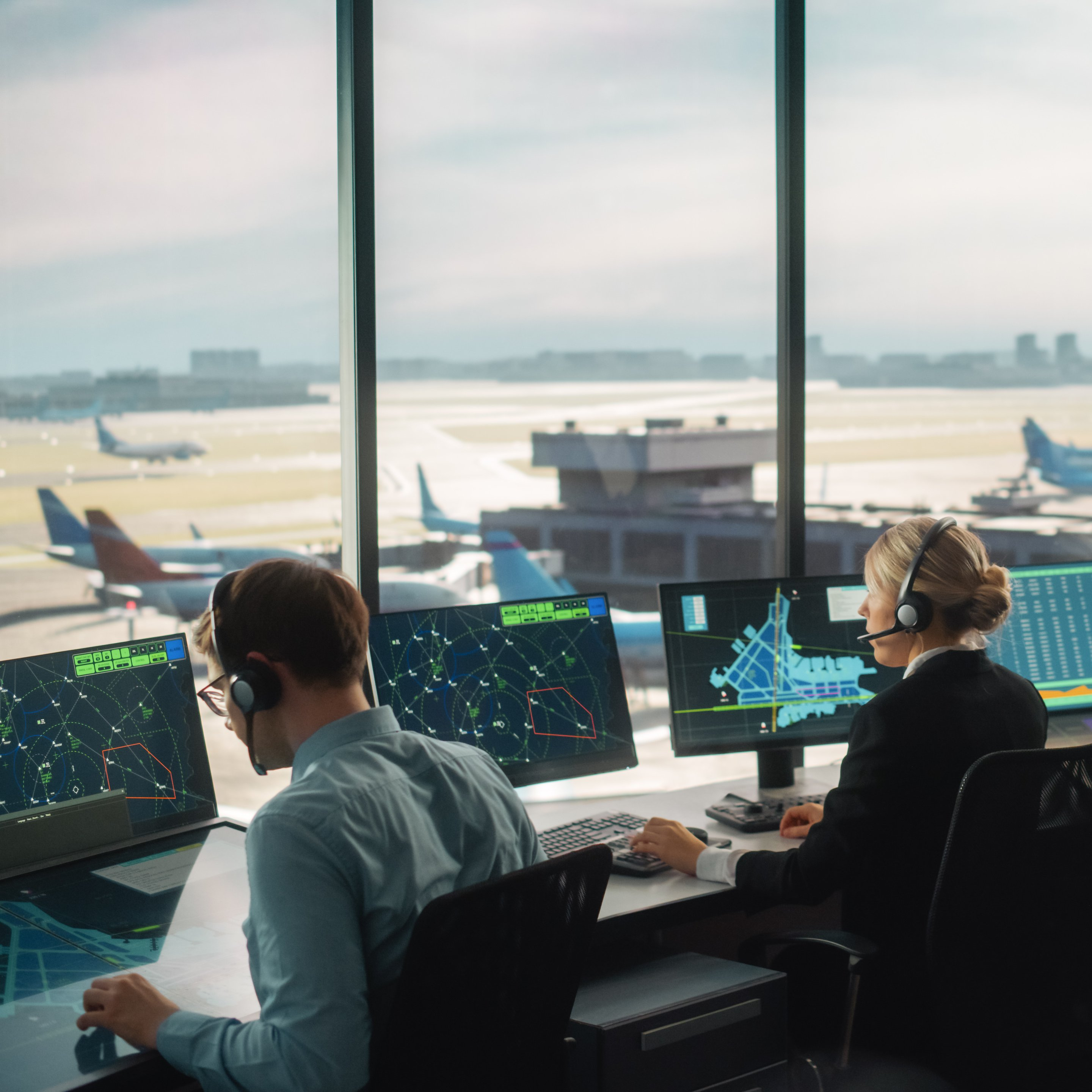 Image presenting two air traffic controllers at work